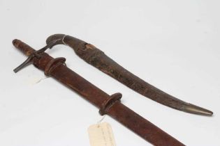 A SUDANESE KASKARA SWORD with 36 1/2" blade, cruciform hilt and leather scabbard, 43" long, together