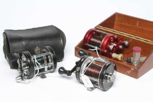 THREE AMBASSADEUR FISHING REELS, comprising one 6000, one 6001C and one 6000C, with one wooden