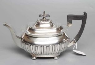 A SILVER TEAPOT, maker Walker & Hall, Sheffield 1919, of semi-fluted oblong baluster form engraved