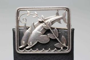 A GEORG JENSEN SILVER OBLONG BROOCH designed by Arno Malinowski cast as two dolphins swimming amidst