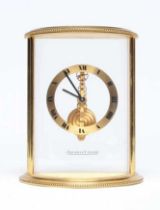 A JAEGER-LECOULTRE SKELETON MANTEL CLOCK with exposed gilt brass jewelled movement, chapter ring