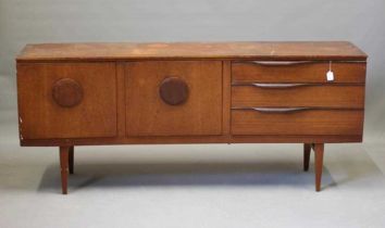A BEAUTILITY TEAK SIDEBOARD, mid-20th century, of curved outline, the fascia with a pair of cupboard