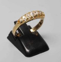 A SEVEN STONE DIAMOND HALF HOOP RING, the mix cut stones claw set to a plain shank stamped 18ct,