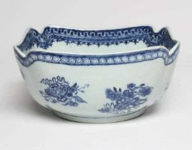 A CHINESE PORCELAIN BOWL of lobed square form painted in underglaze blue with precious objects below