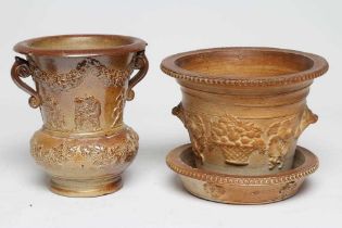 A SALTGLAZE STONEWARE CACHE-POT AND STAND, early 19th century, of baluster form with two scroll