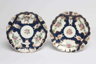 A PAIR OF FIRST PERIOD WORCESTER PORCELAIN PLATES, c.1770, of circular form with fluted rims,