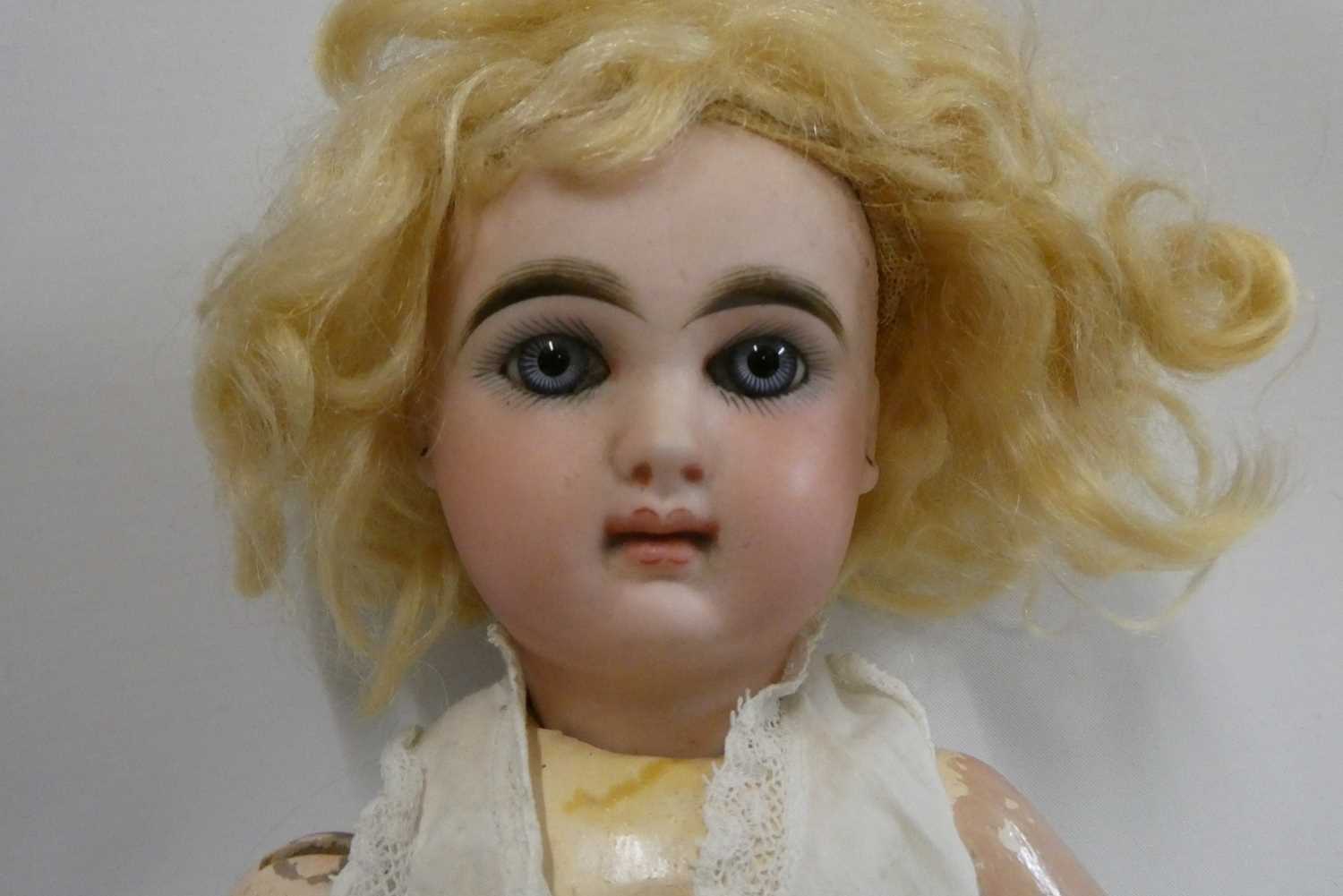 A French bisque socket head girl doll, with blue glass fixed eyes, moulded closed mouth, pierced - Image 2 of 4