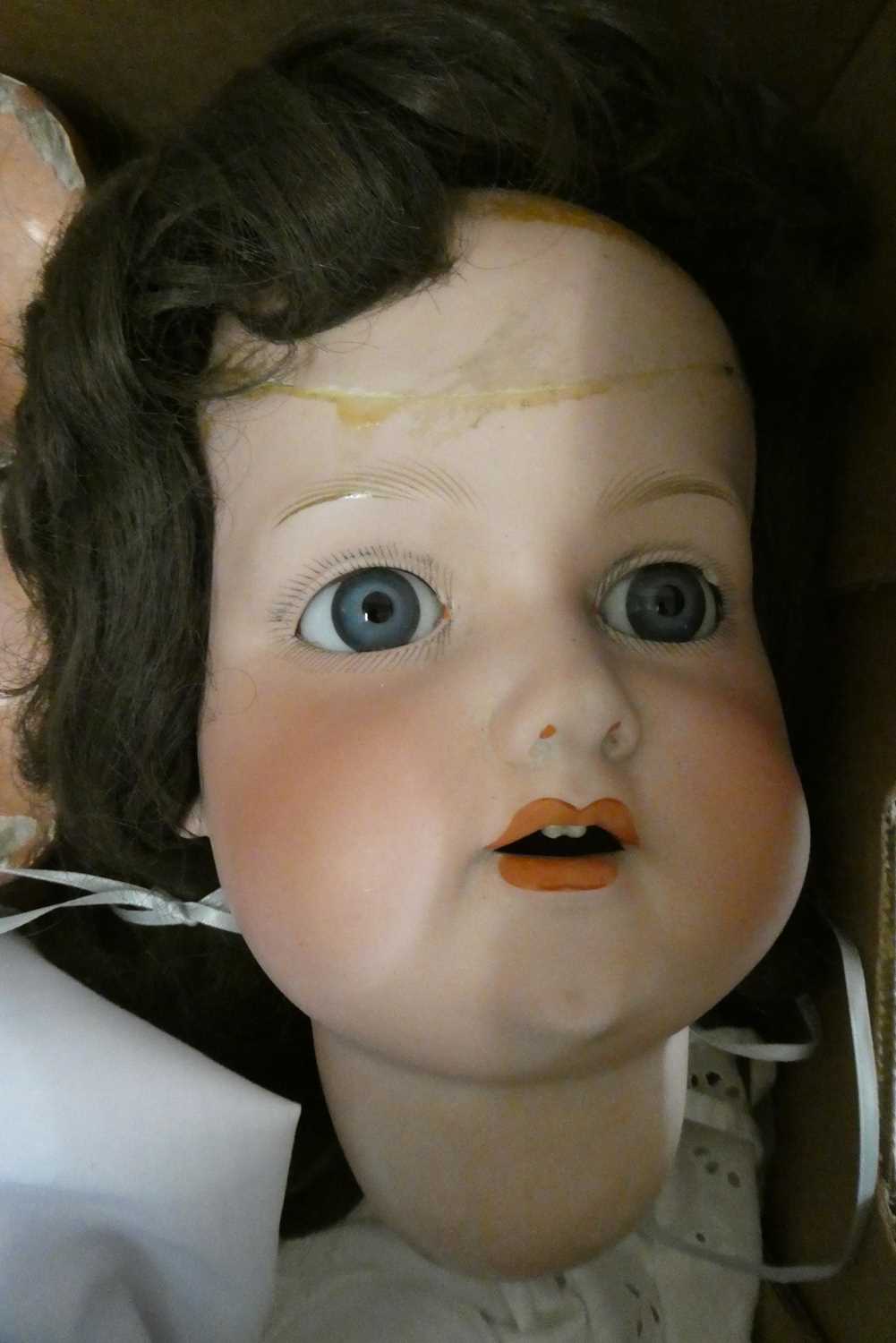 An Armand Marseille bisque socket head doll, with blue glass fixed eyes, open mouth, teeth, - Image 2 of 3