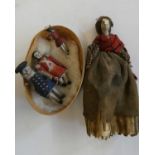 Three wooden piano dolls, c.1880, with painted features and jointed legs, largest 2 1/4" long,