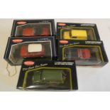 Five Kyosho 1/18th scale cars comprising AA Mini van, Triump TR3, Mini Cooper, Mini traveller and