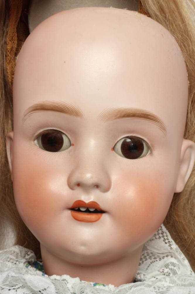 A large Schoenau & Hoffmeister bisque socket head doll, with brown glass sleeping eyes, oepn - Image 2 of 3