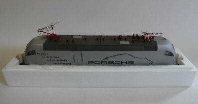 Piko electric German type pentagraph locomotive finished in silver with Porsche livery, boxed,