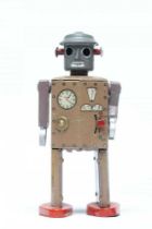 An original 1940’s version of the clockwork ATOMIC MAN tinplate Robot, clockwork walking mechanism