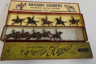 Two boxed sets of Britains Hussars on horseback, pre-war version, box fair, models fair, post-war