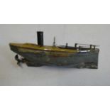 Small Carette clockwork steamboat, motor tested working, rudder, flagpole and boat stand missing,