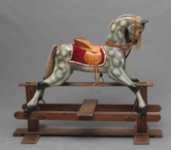 Rocking horse, 20th century, of carved wood construction, painted in dappled grey, with horse hair