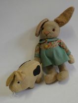 Two Merrythought stuffed toys, comprising a 21" rabbit with white plush and felt dress, and a 9"