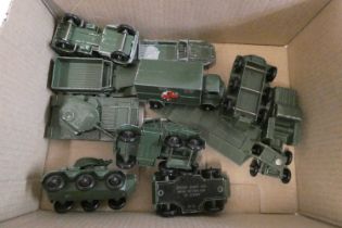 Ten unboxed Matchbox army vehicles including tank transporter, green truck, tank and ambulance,