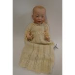 A Kammer & Reinhardt bisque socket head character doll, with painted features, bent limb composition