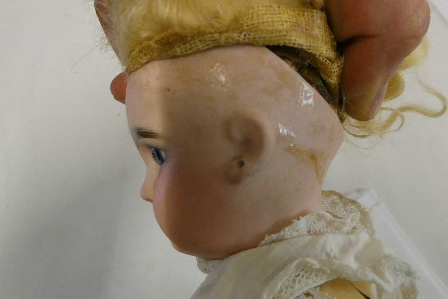 A French bisque socket head girl doll, with blue glass fixed eyes, moulded closed mouth, pierced - Image 3 of 4