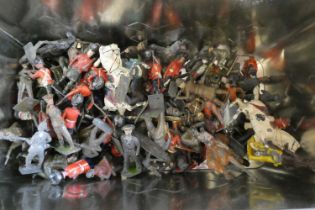 Unboxed lead solders by Britains and others including Guards on Horseback, cowboys and Indians,