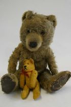 Two vintage bears, comprising a 13" bear with amber eyes and sewn nose, and a 5 1/4" orange