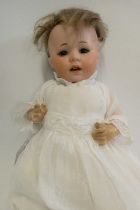 A German bisque socket head doll, with brown glass sleeping eyes, oepn mouth, teeth, bent limb