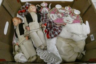 A box of dolls, clothing and accessories, including a pair of vintage composition head boys, a