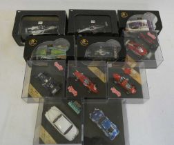 Eleven vintage and modern race cars by IXO, Hot Wheels and others including Ferrari and Jaguar,