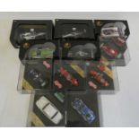 Eleven vintage and modern race cars by IXO, Hot Wheels and others including Ferrari and Jaguar,