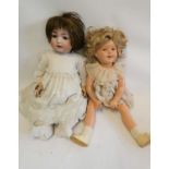 A bisque socket head character doll, with brown glass sleeping eyes, open mouth and applied teeth,