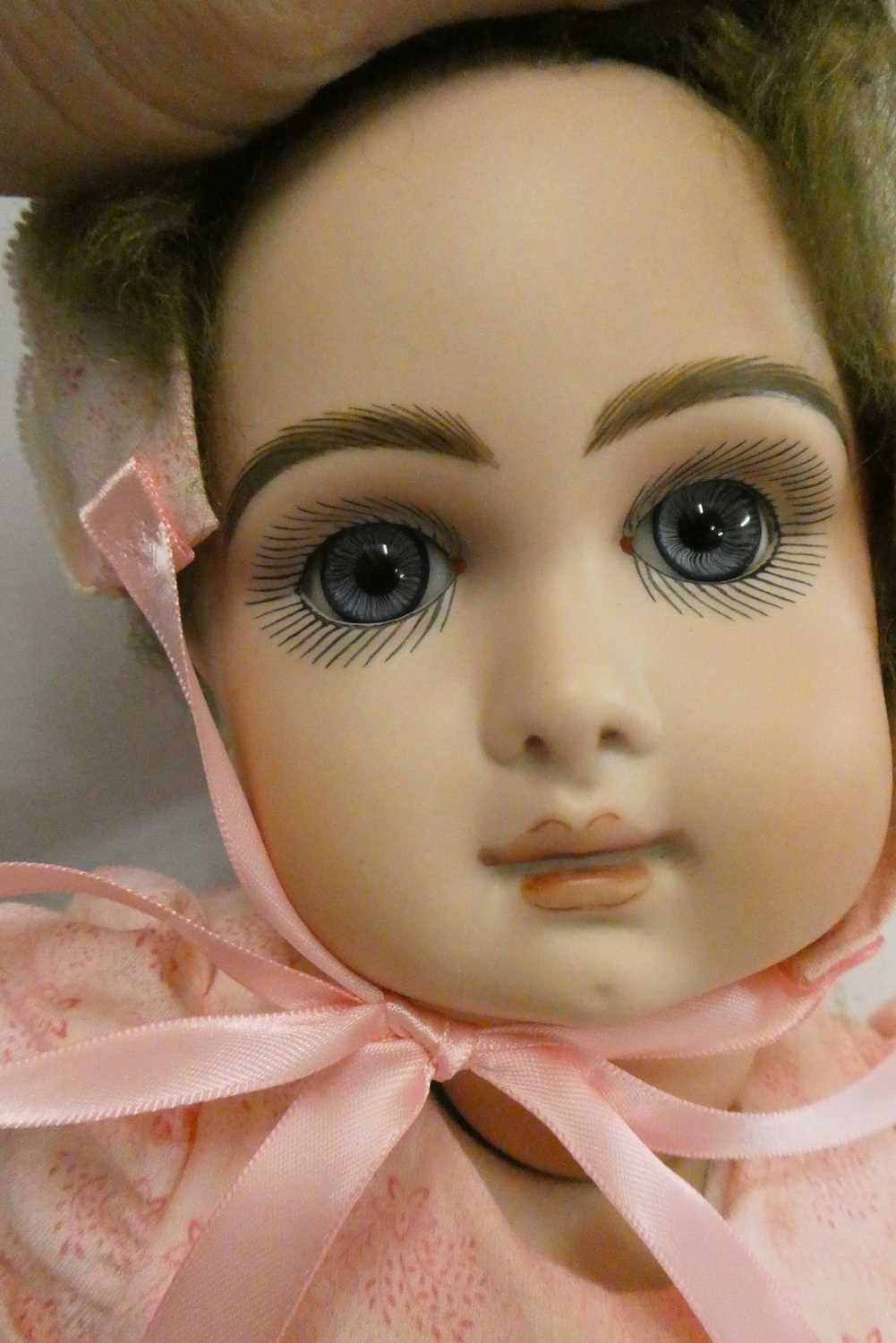 A reproduction "Jumeau" bisque socket head doll, with blue glass fixed eyes, closed mouth, pierced - Image 2 of 3