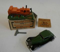 Triangle Minic Bulldozer, plastic body with metal shovel, boxed with key, one box flap detached, box