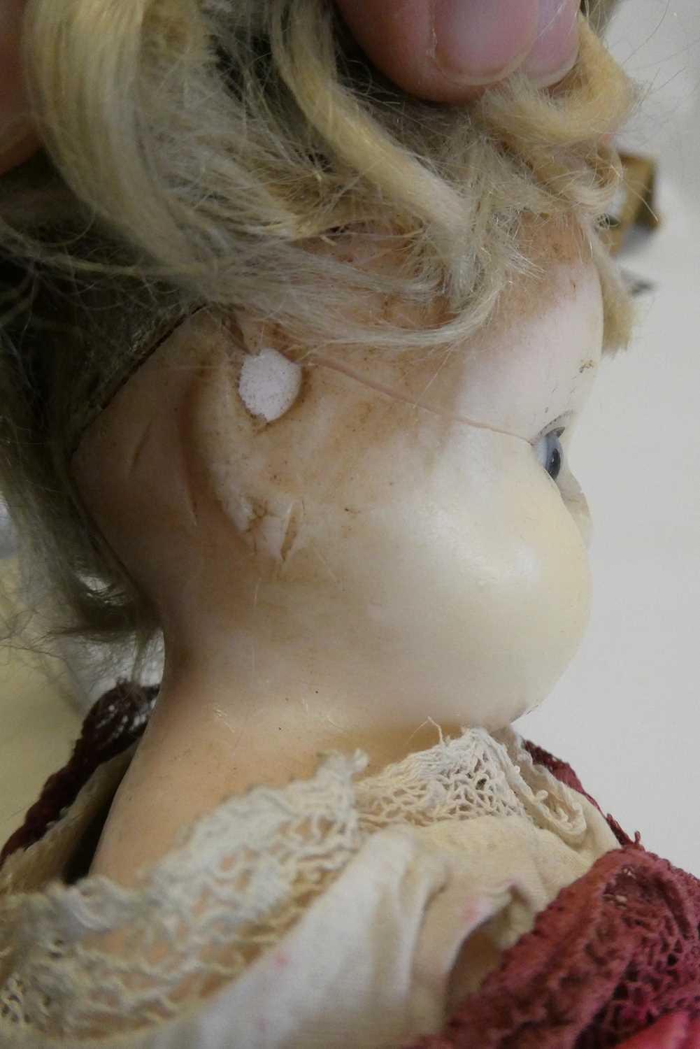 A Victorian wax shoulder head doll, with blue glass eyes, blond hair, closed mouth, kid body and - Image 4 of 5