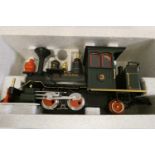 Three L.G.B models comprising 22130 0-4-2 locomotive, and two 4 wheel coaches, all items boxed, good