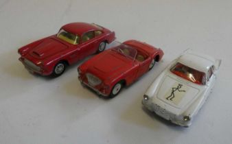 Three Corgi vehicles comprising Aston Martin DB4, Austin Healey 100 and the Saint’s Volvo P 1800,