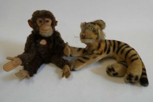 Two vintage Steiff animals, comprising a Jocko monkey and a tiger, both with card labels, Jocko with