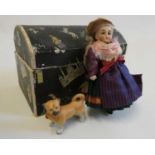 An all bisque dolls house doll, with brown glass fixed eyes, blond wig, straight legs, moulded shoes