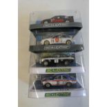 Four Scalextric cars comprising two Ford Sierra RS500, Ford Escort and MK2 Ford Escort MK1, all