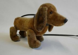 Schuco walking sausage dog, 1950s, with "trip-trap" motion and lead, 11" long Condition Report: