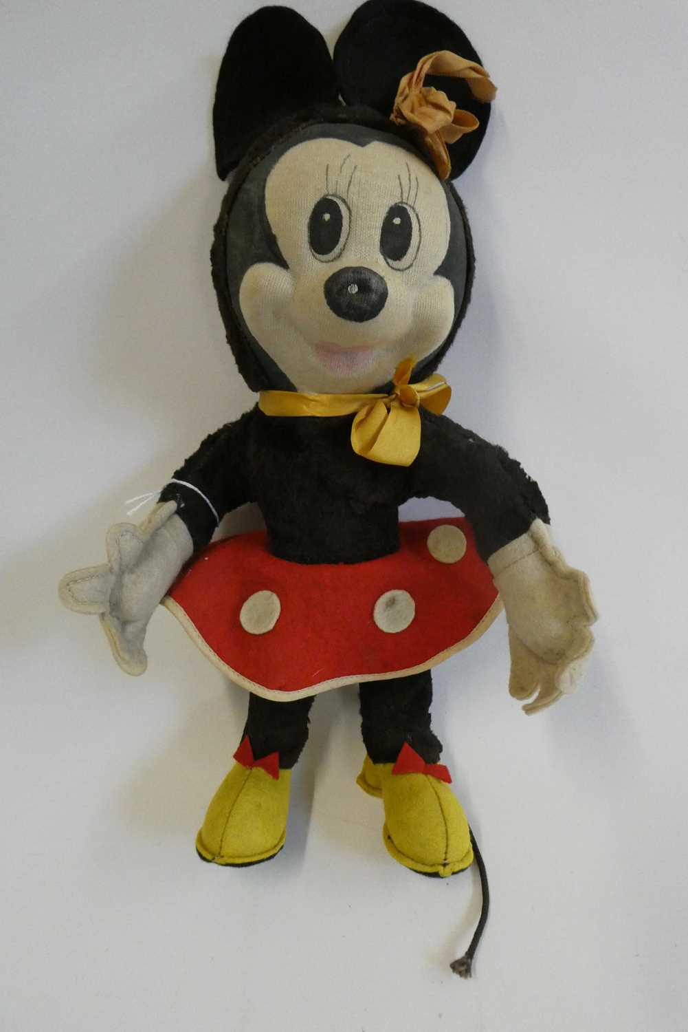 Merrythought Minnie Mouse, with fabric face, plush body, felt clothing and maker's label to foot,