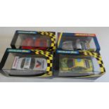 Four Scalextric saloon race cars comprising three TVR’s and Opel V8 coupe, all items boxed