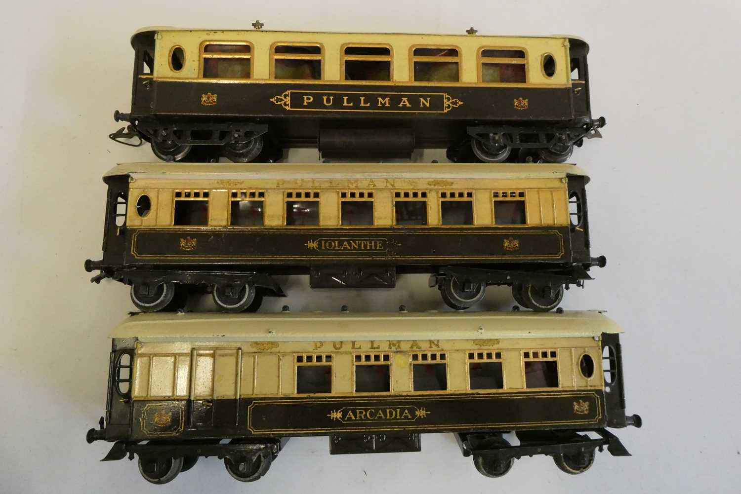 Three Hornby Pullman coaches including Iolanthe and Arcadian, some paint damage and window