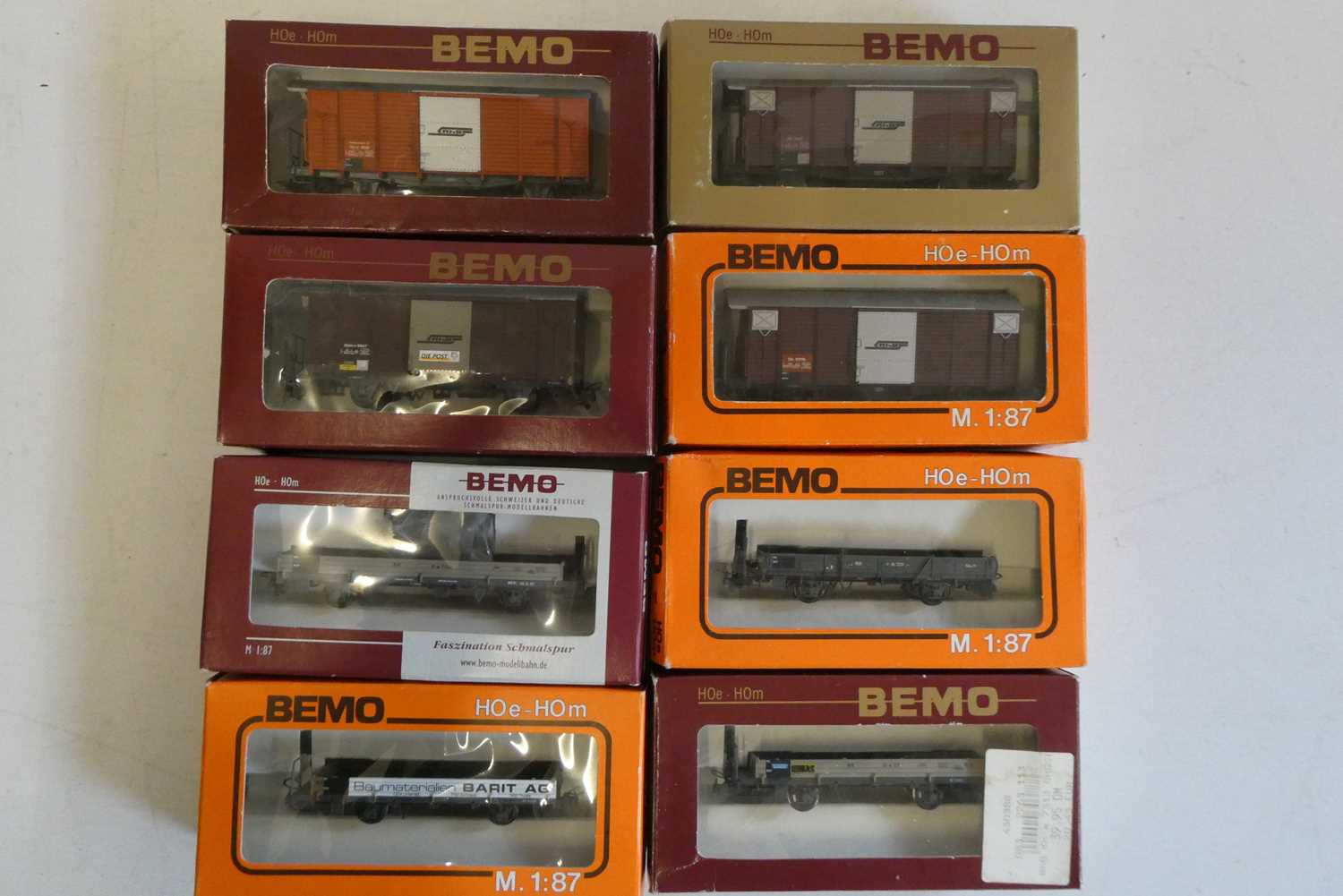 Eight Bemo HOm goods wagons comprising four covered van and four open wagons, all items boxed,