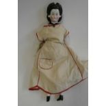 A china shoulder head doll, c.1880, with moulded hair, painted features, china lower limbs,