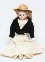 A Belton type bisque shoulder head doll, with brown glass eyes, closed mouth, blond wig, kid body,