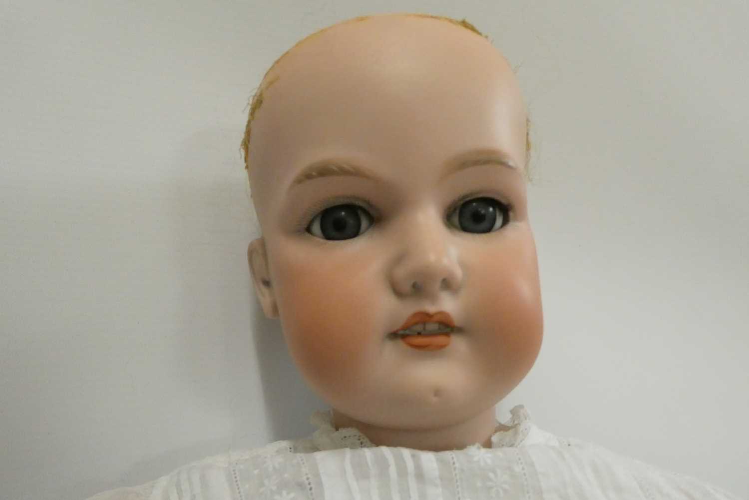 A large Armand Marseille bisque socket head doll, with blue glass sleeping eyes, open mouth, - Bild 2 aus 4