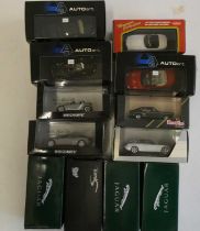 Twelve 1/43rd scale modern model cars by Auto Art Mini Champs and others including Jaguar Ford and