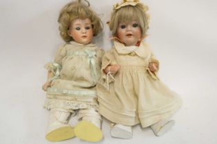 Two Heubach socket head dolls, one 11 1/2" 6970 doll with sleeping eyes, closed mouth and fixed