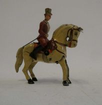 Clockwork dressage horse and rider with hopping action from horse. Tested in good working order,